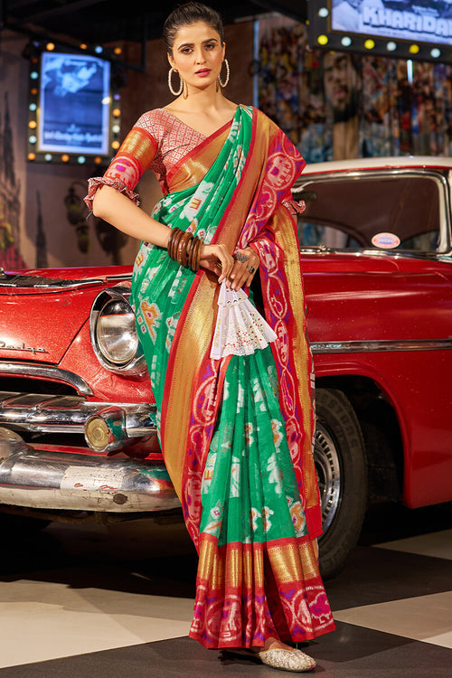 Load image into Gallery viewer, Invaluable Green Patola Silk Saree with Arresting Blouse Piece
