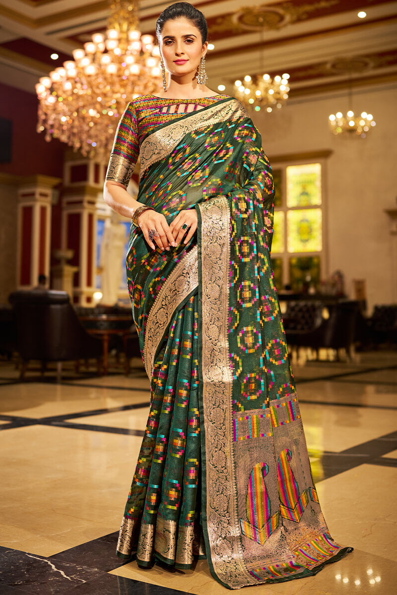 Sumptuous Dark Green Organza Silk Saree With Vestigial Blouse Piece
