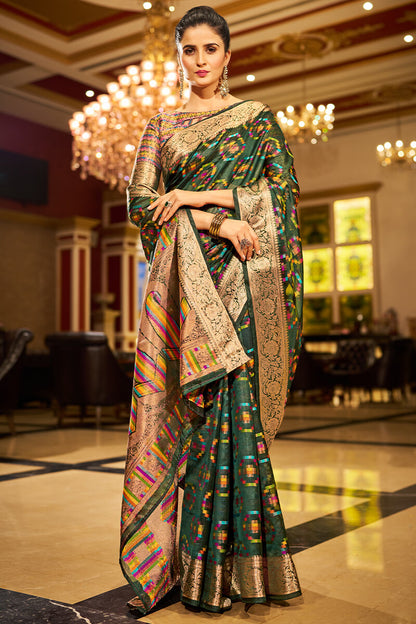 Sumptuous Dark Green Organza Silk Saree With Vestigial Blouse Piece
