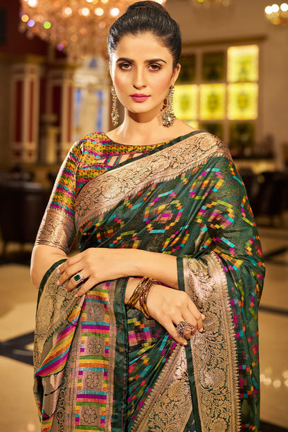 Sumptuous Dark Green Organza Silk Saree With Vestigial Blouse Piece