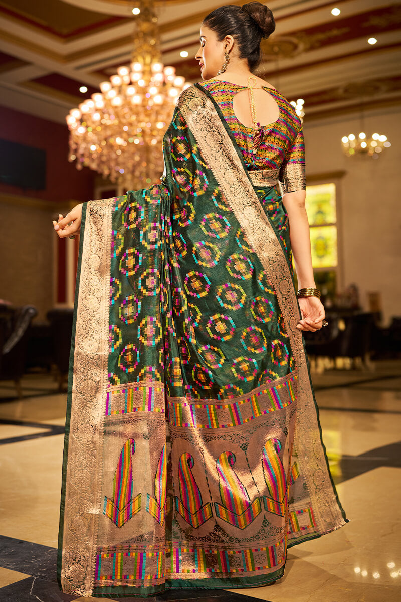 Sumptuous Dark Green Organza Silk Saree With Vestigial Blouse Piece