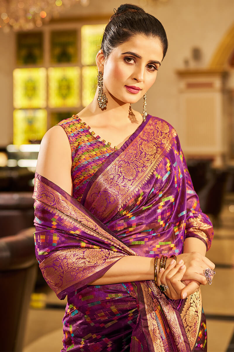 Cynosure Purple Organza Silk Saree With Engaging Blouse Piece