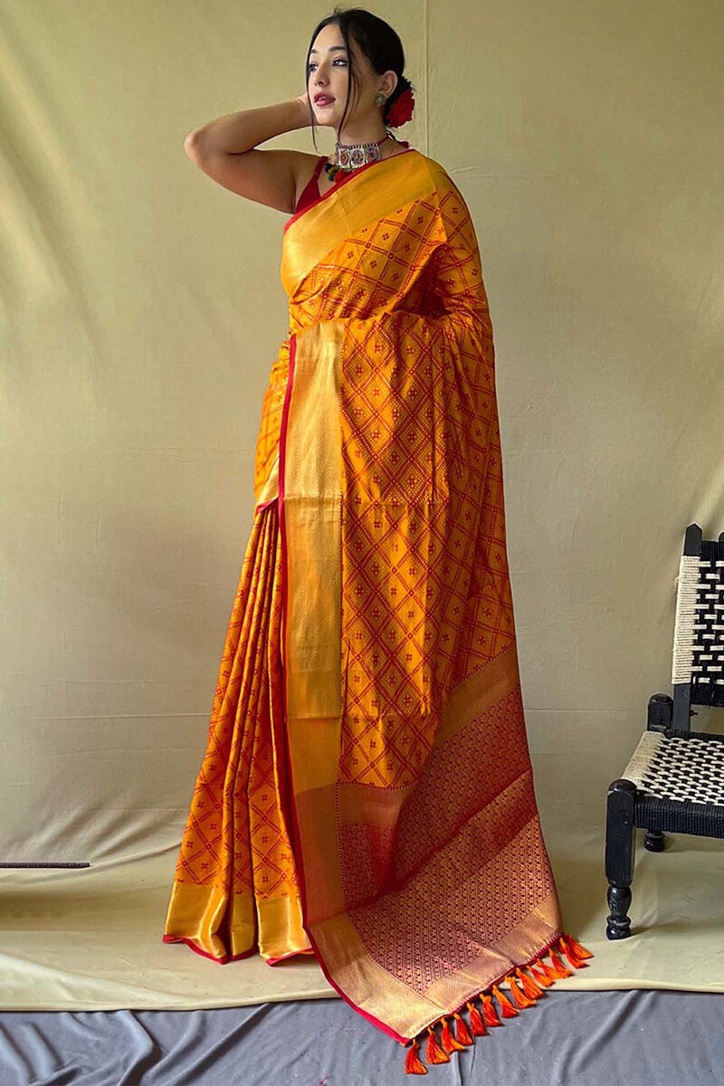 Beauteous Mustard Patola Silk Saree with Delectable Blouse Piece