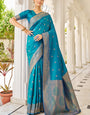 Cynosure Firozi Kanjivaram Silk Saree With Comely Blouse Piece