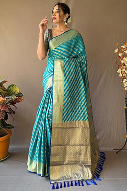 Symmetrical Firozi Soft Banarasi Silk Saree With Snazzy Blouse Piece