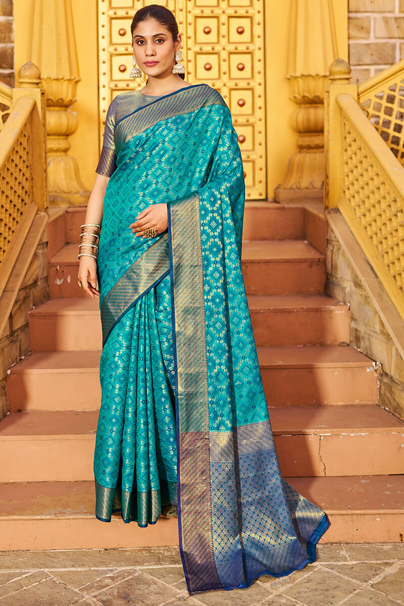 Mesmerising Firozi Patola Silk Saree with Precious Blouse Piece