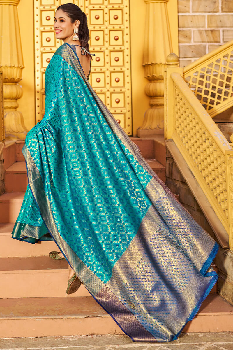 Mesmerising Firozi Patola Silk Saree with Precious Blouse Piece