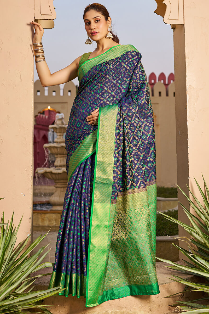 Classy Navy Blue Patola Silk Saree with Marvellous Blouse Piece