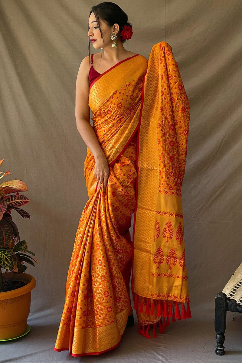 Jubilant Mustard Patola Silk Saree with Lovely Blouse Piece
