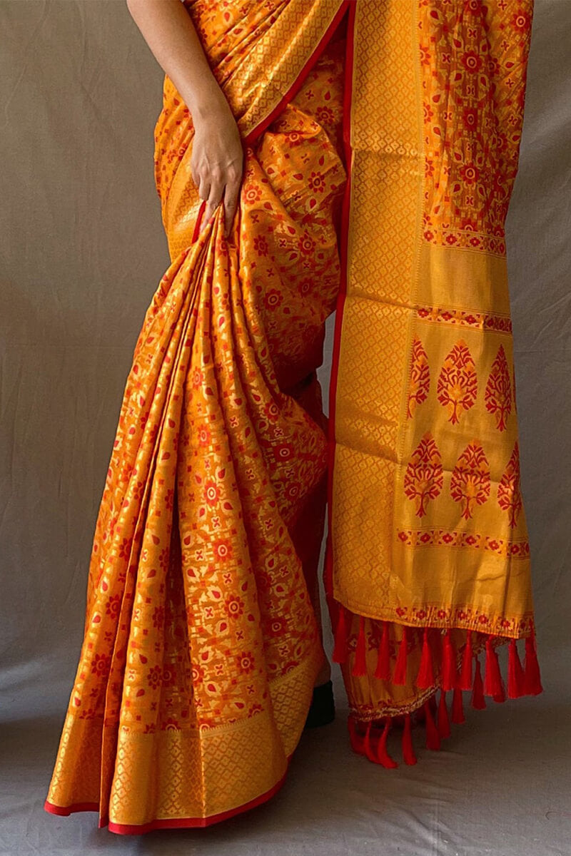 Jubilant Mustard Patola Silk Saree with Lovely Blouse Piece