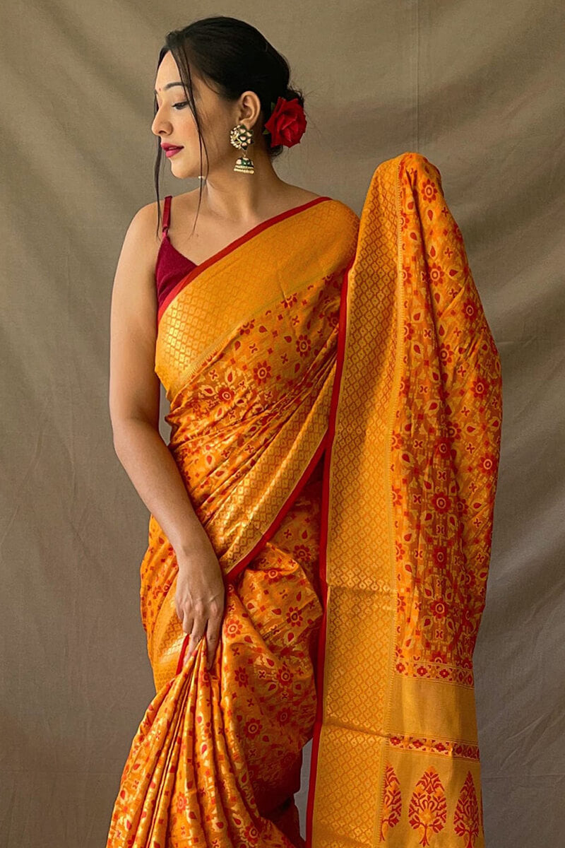 Jubilant Mustard Patola Silk Saree with Lovely Blouse Piece