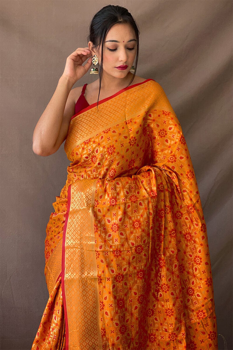 Jubilant Mustard Patola Silk Saree with Lovely Blouse Piece
