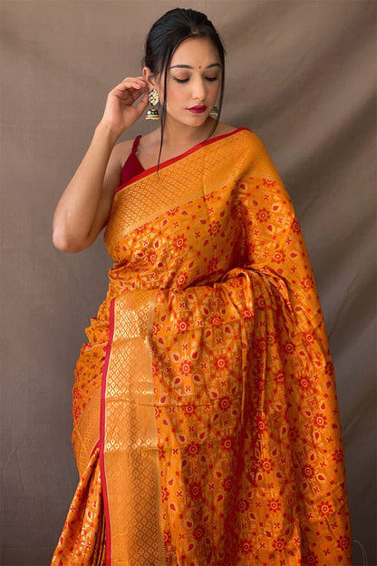 Jubilant Mustard Patola Silk Saree with Lovely Blouse Piece
