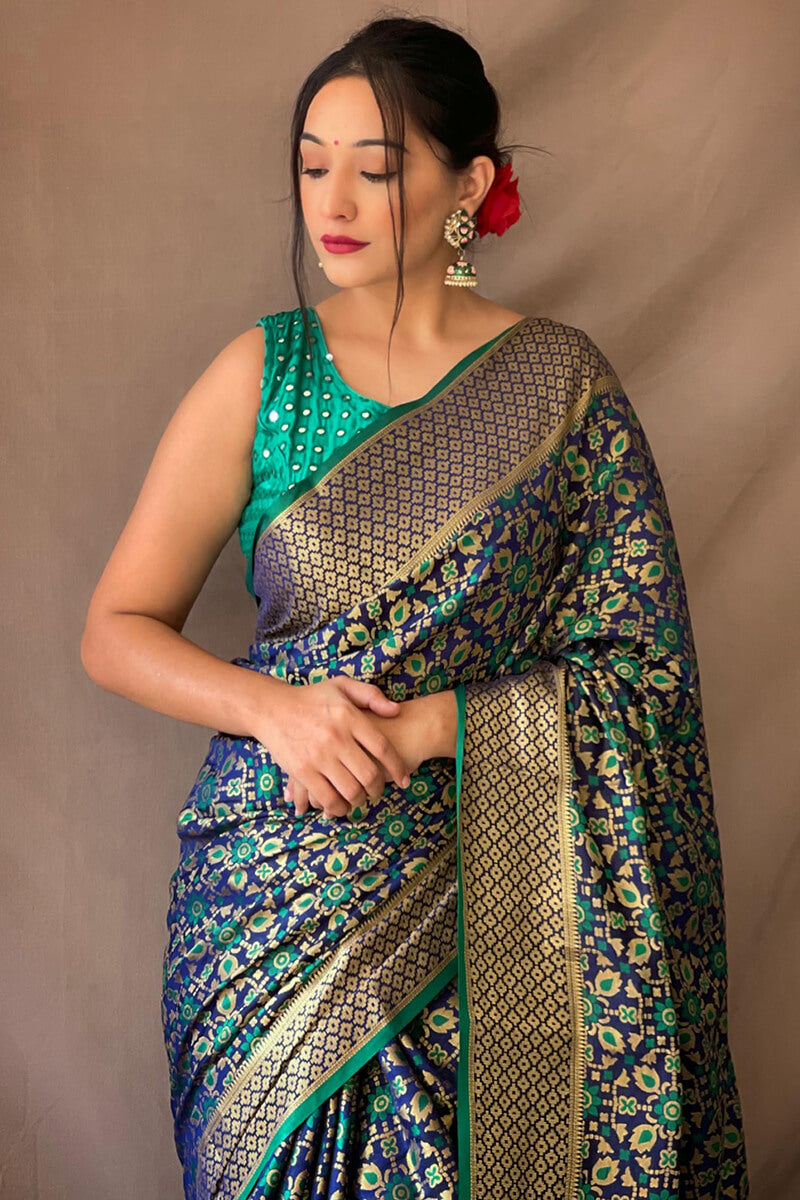 Precious Navy Blue Patola Silk Saree with Nectarous Blouse Piece