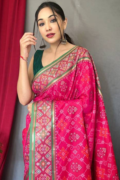 Incomparable Dark Pink Patola Silk Saree with Fairytale Blouse Piece