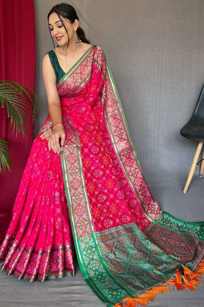 Incomparable Dark Pink Patola Silk Saree with Fairytale Blouse Piece