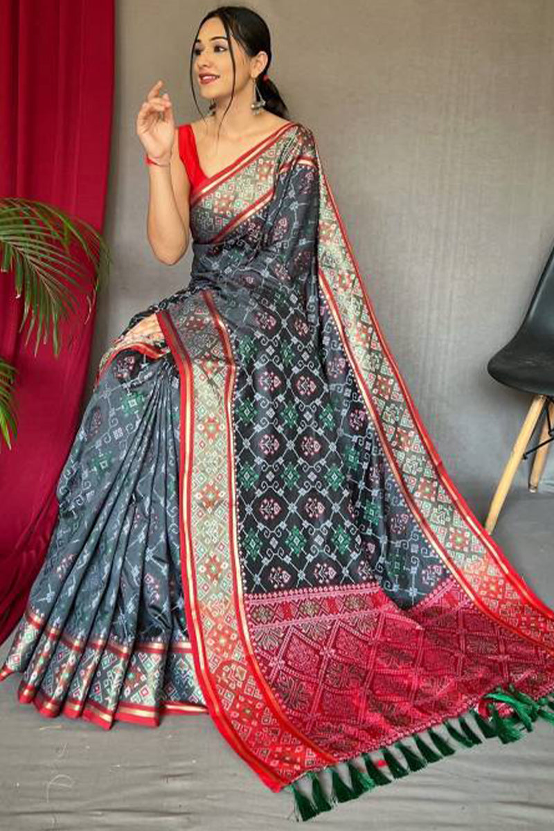 Piquant Grey Patola Silk Saree with Sempiternal Blouse Piece