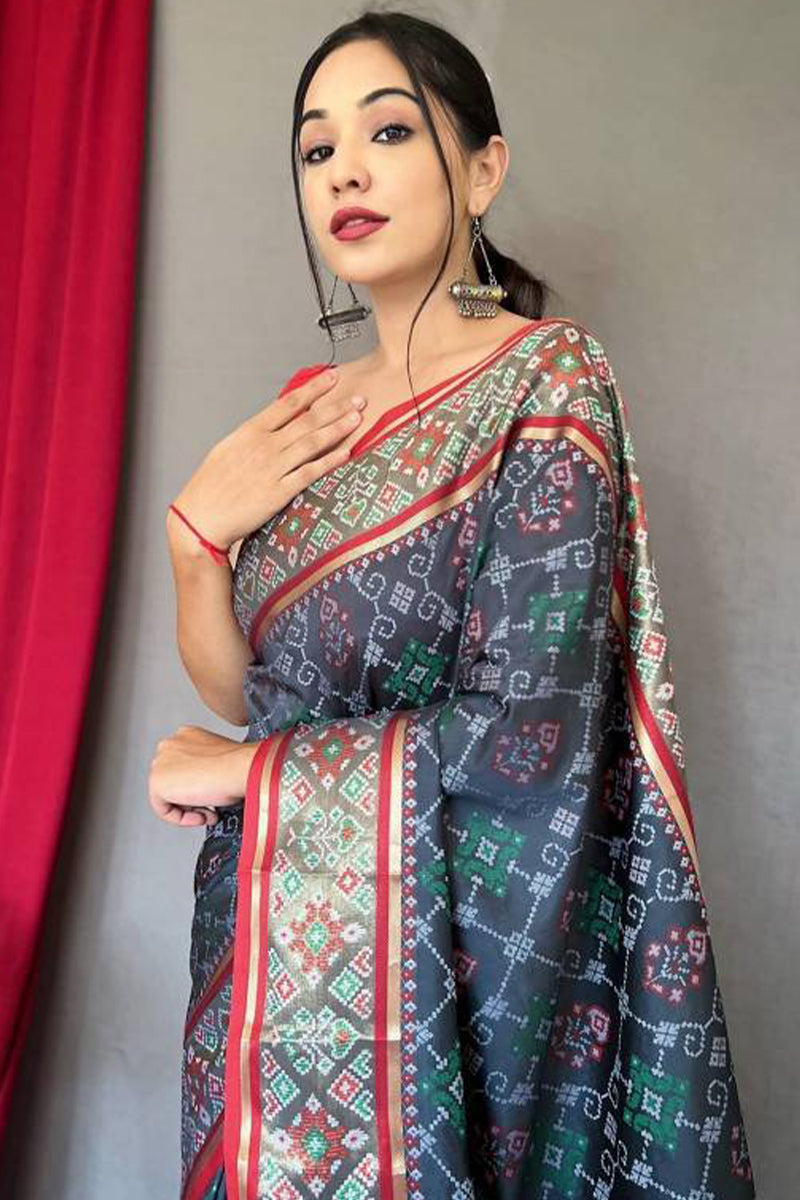 Piquant Grey Patola Silk Saree with Sempiternal Blouse Piece