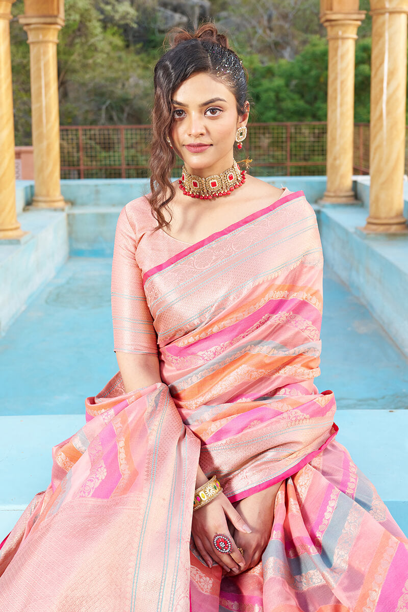 Mesmerising Pink Organza Silk Saree With Delightful Blouse Piece