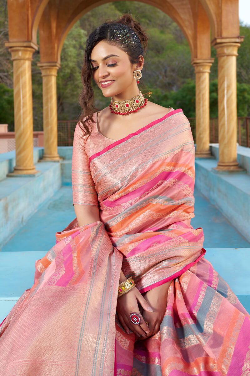 Mesmerising Pink Organza Silk Saree With Delightful Blouse Piece