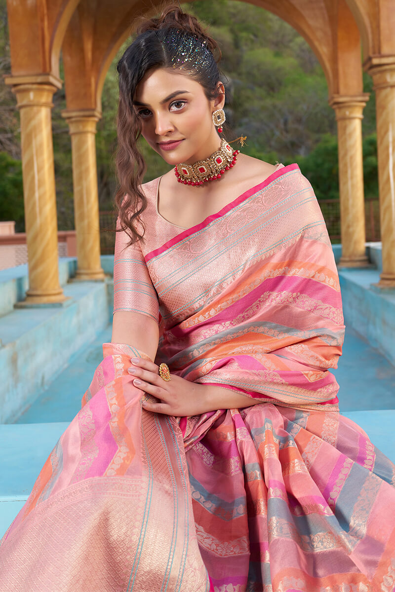 Mesmerising Pink Organza Silk Saree With Delightful Blouse Piece