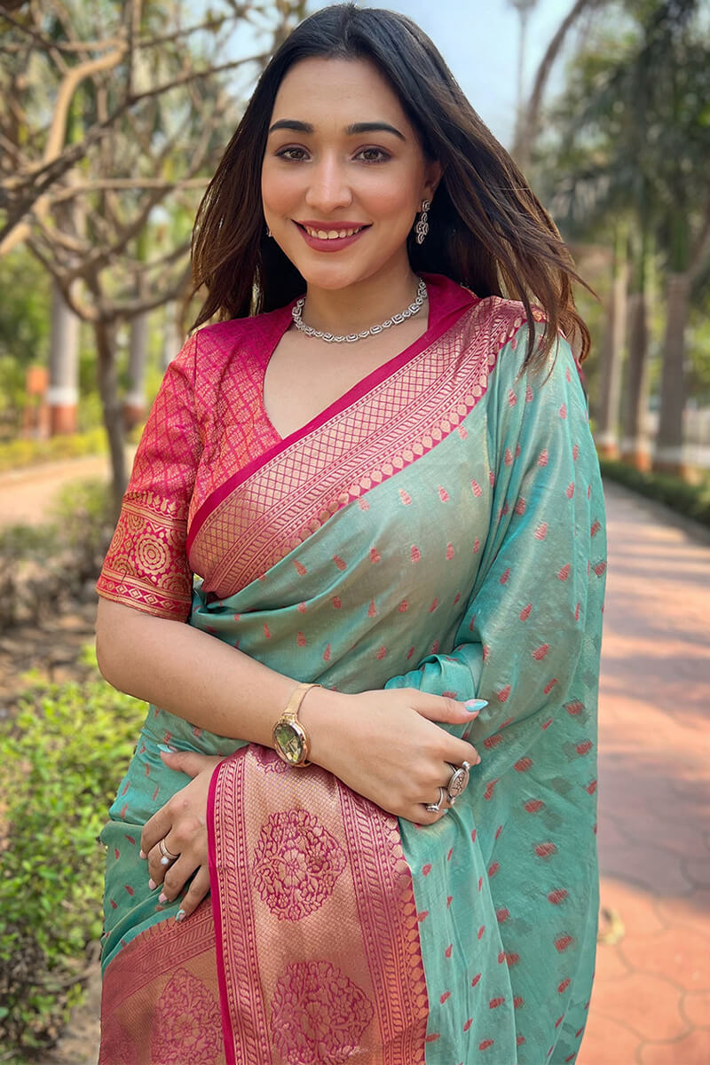 Sonorous Firozi Soft Banarasi Tissue Silk Saree With Brood Blouse Piece