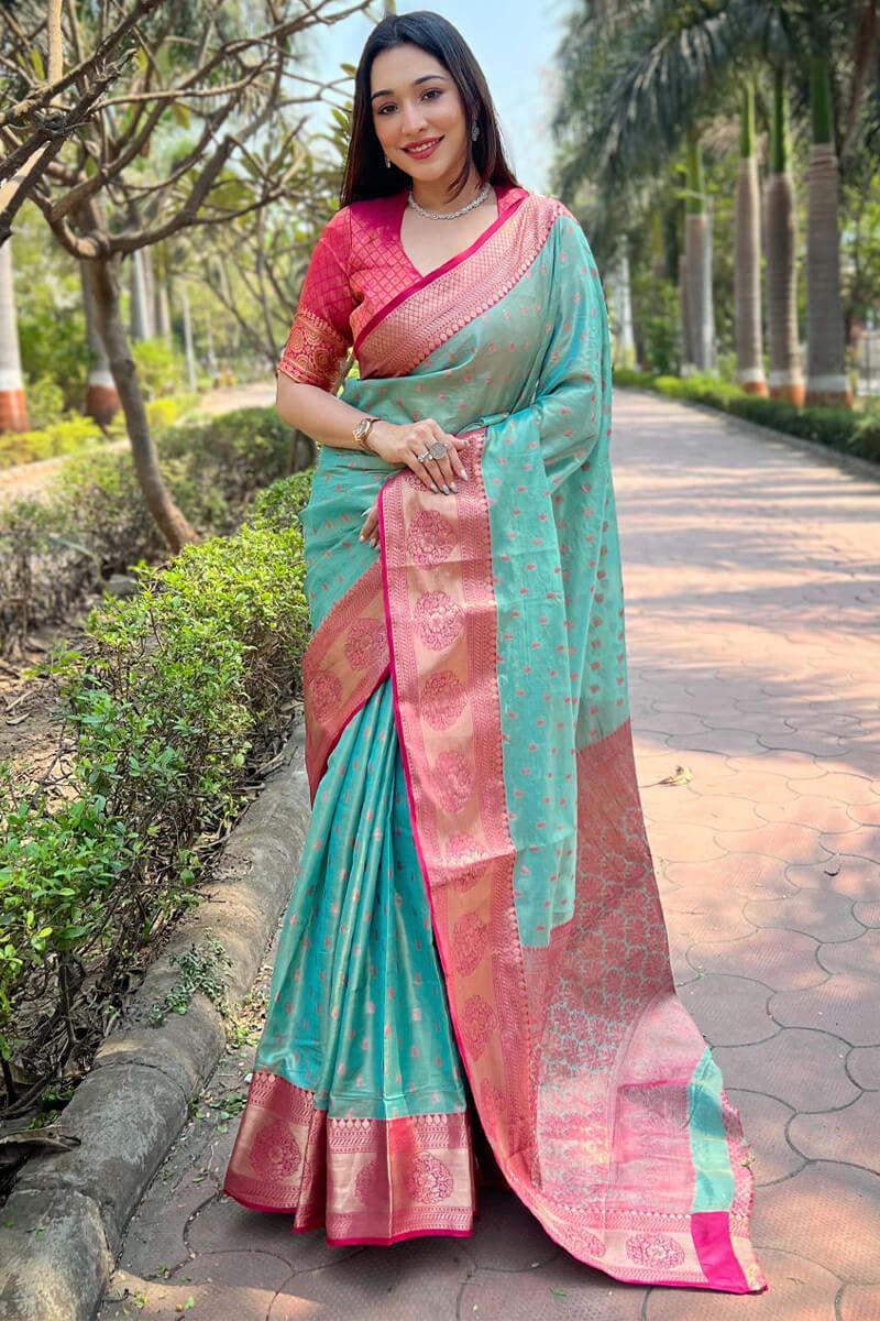 Sonorous Firozi Soft Banarasi Tissue Silk Saree With Brood Blouse Piece