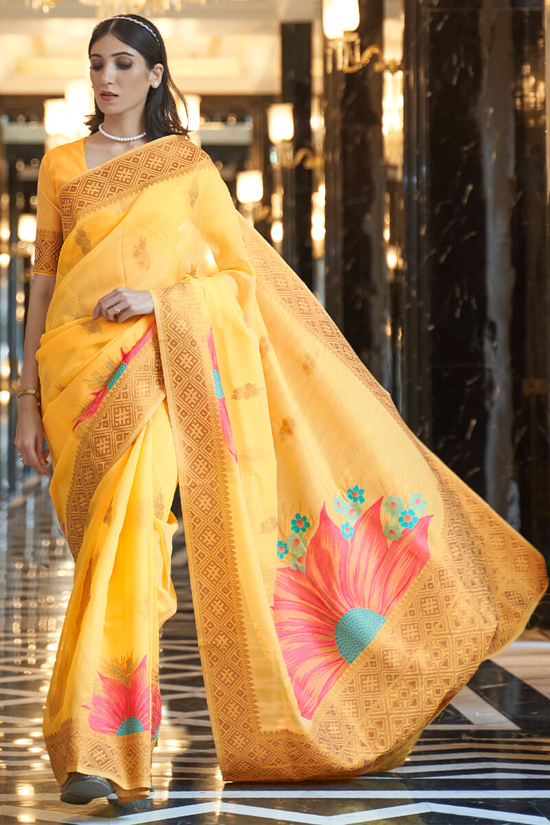 Pretty Yellow Cotton Silk Saree With Gleaming Blouse Piece