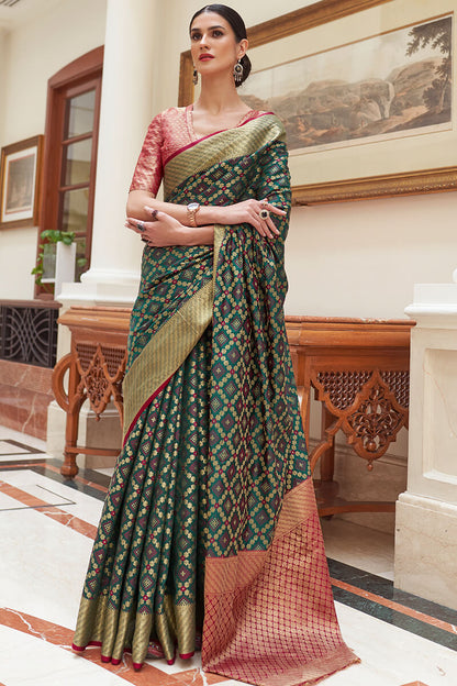 Staggering Dark Green Soft Patola Silk Saree with Imaginative Blouse Piece