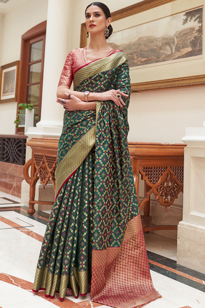 Staggering Dark Green Soft Patola Silk Saree with Imaginative Blouse Piece