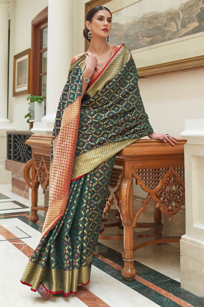 Staggering Dark Green Soft Patola Silk Saree with Imaginative Blouse Piece