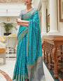 Sumptuous Firozi Soft Patola Silk Saree with Palimpsest Blouse Piece