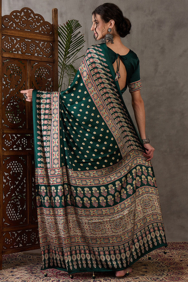 Gratifying Dark Green Ajrakh Printed Semi Modal Silk Saree With Entrancing Blouse Piece