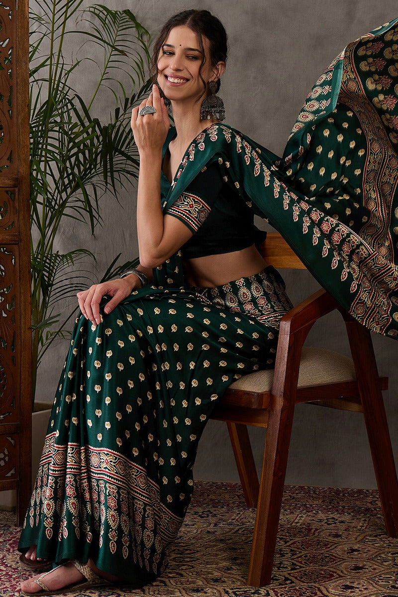 Gratifying Dark Green Ajrakh Printed Semi Modal Silk Saree With Entrancing Blouse Piece