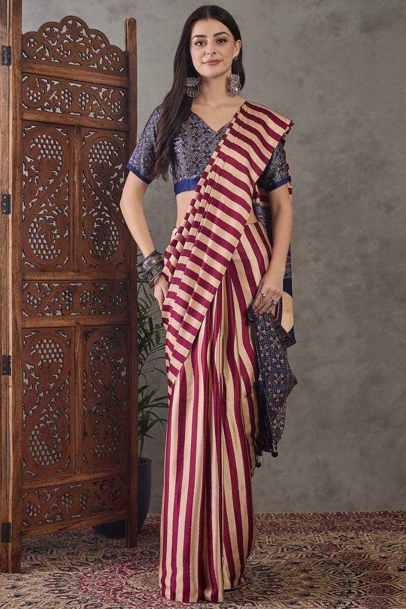 Prominent Maroon Ajrakh Printed Semi Modal Silk Saree With Engaging Blouse Piece