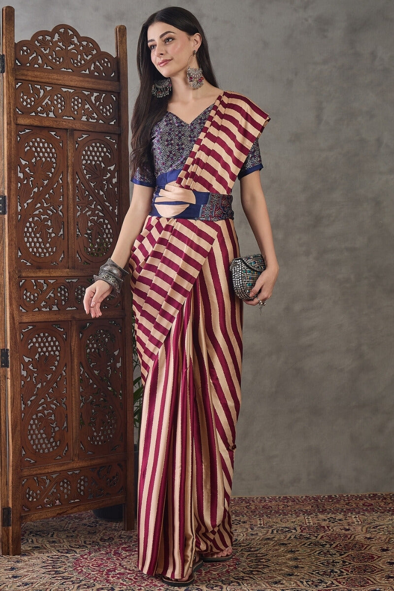 Prominent Maroon Ajrakh Printed Semi Modal Silk Saree With Engaging Blouse Piece