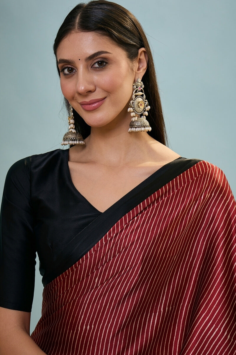 Enthralling Maroon Ajrakh Printed Semi Modal Silk Saree With Desuetude Blouse Piece