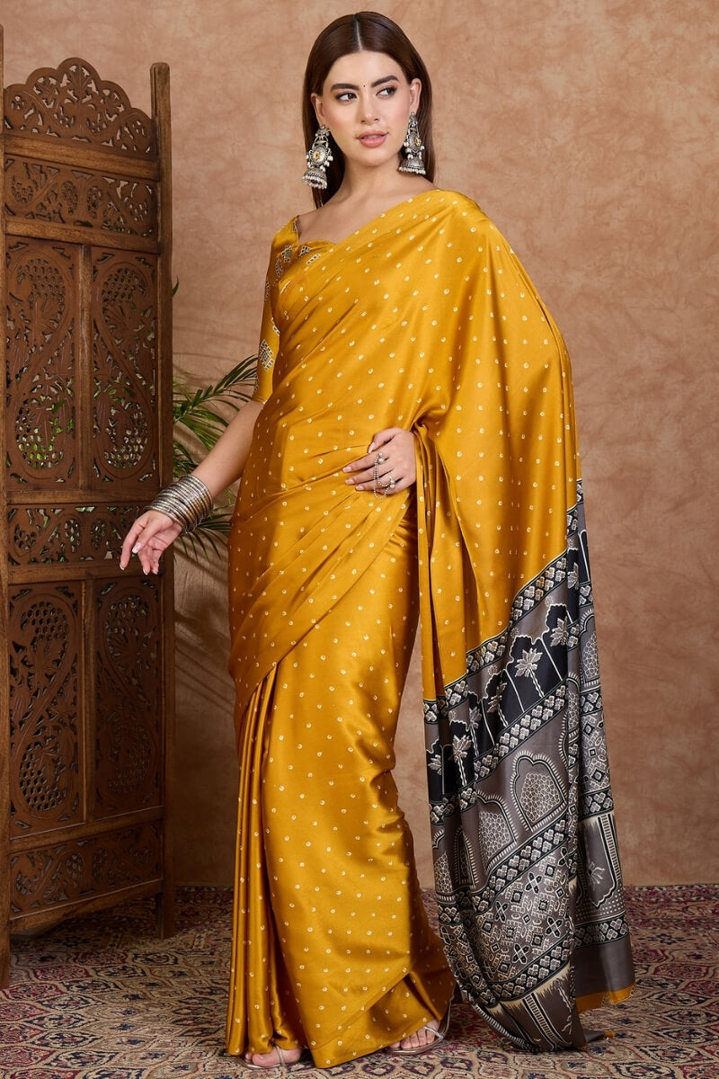 Adorning Mustard Ajrakh Printed Semi Modal Silk Saree With Tantalizing Blouse Piece