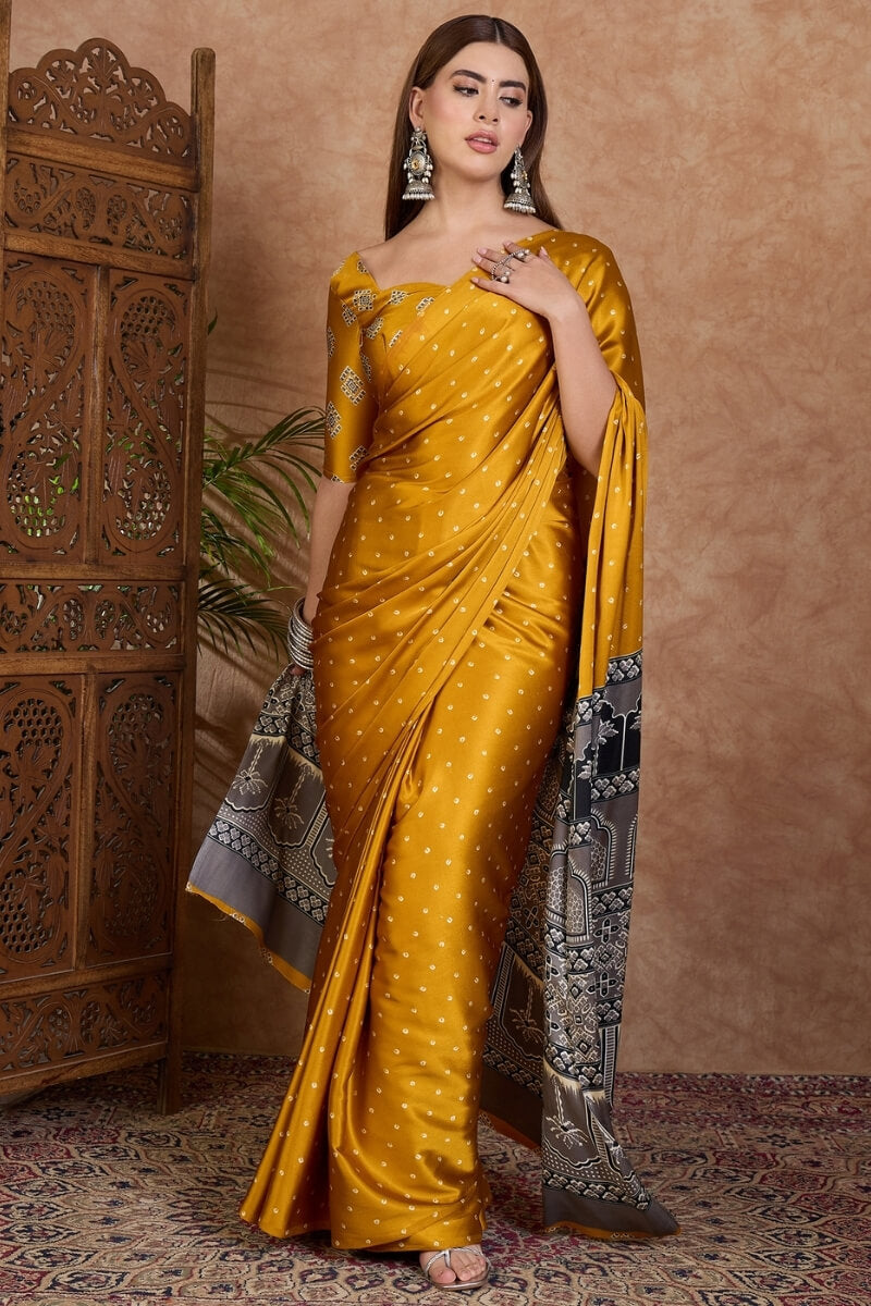 Adorning Mustard Ajrakh Printed Semi Modal Silk Saree With Tantalizing Blouse Piece