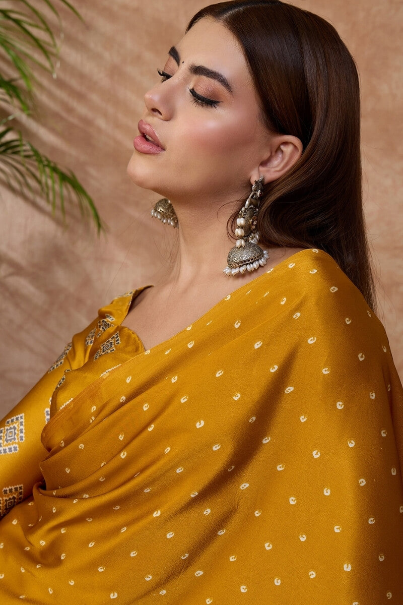 Adorning Mustard Ajrakh Printed Semi Modal Silk Saree With Tantalizing Blouse Piece