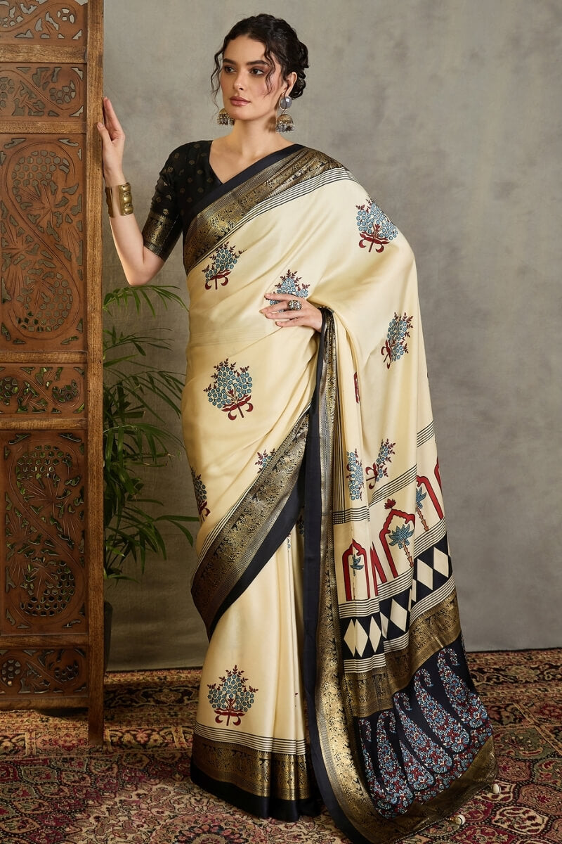 Pulsating Off White Ajrakh Printed Semi Modal Silk Saree With Forbearance Blouse Piece