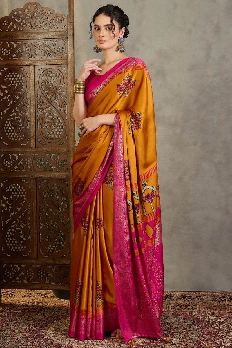 Amiable Mustard Ajrakh Printed Semi Modal Silk Saree With Gratifying Blouse Piece