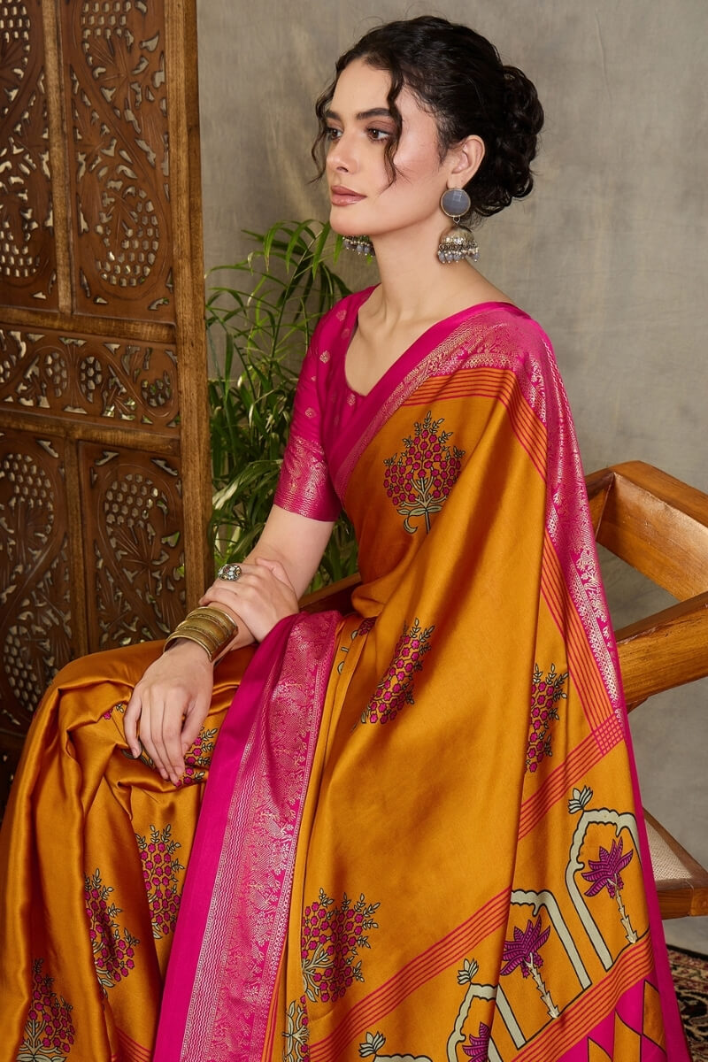 Amiable Mustard Ajrakh Printed Semi Modal Silk Saree With Gratifying Blouse Piece