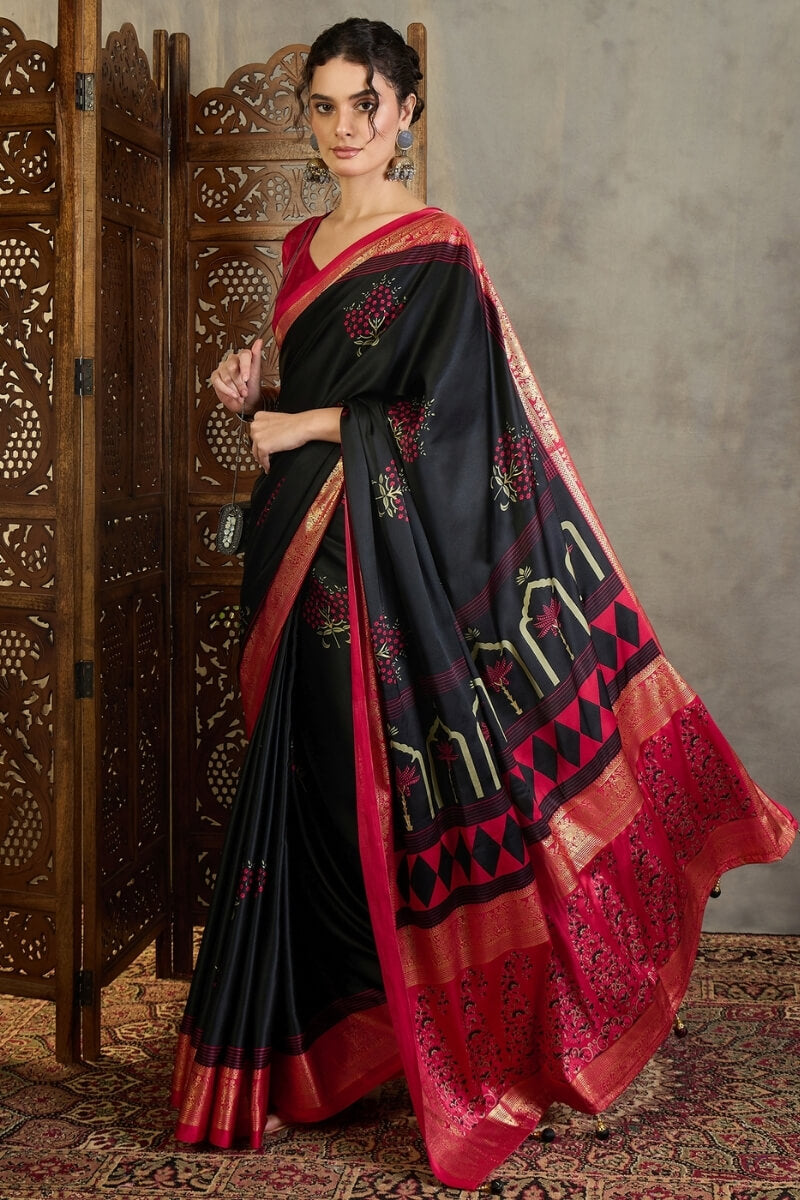 Adoring Black Ajrakh Printed Semi Modal Silk Saree With Nectarous Blouse Piece
