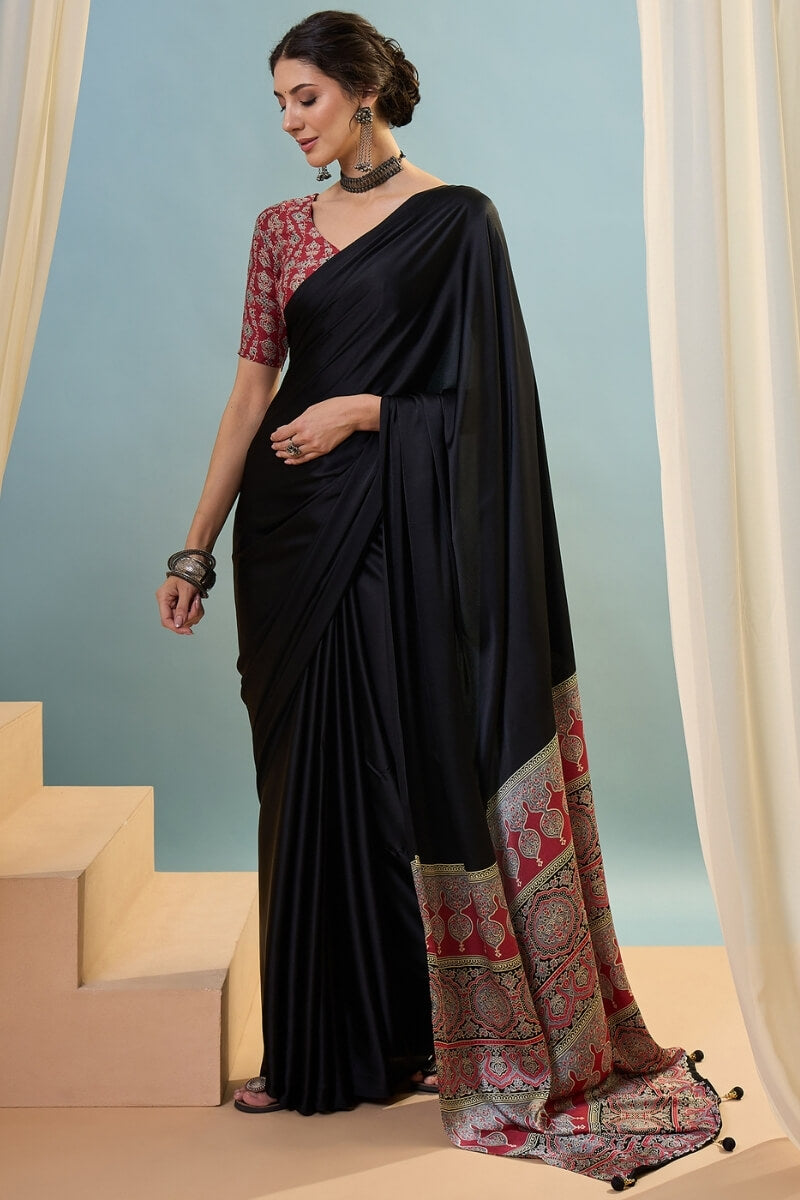Innovative Black Ajrakh Printed Semi Modal Silk Saree With Snazzy Blouse Piece