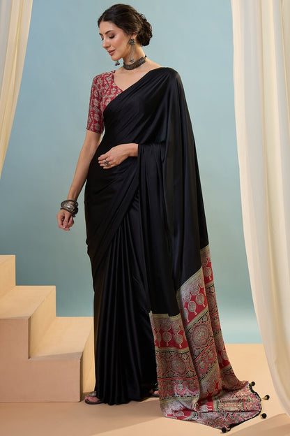 Innovative Black Ajrakh Printed Semi Modal Silk Saree With Snazzy Blouse Piece