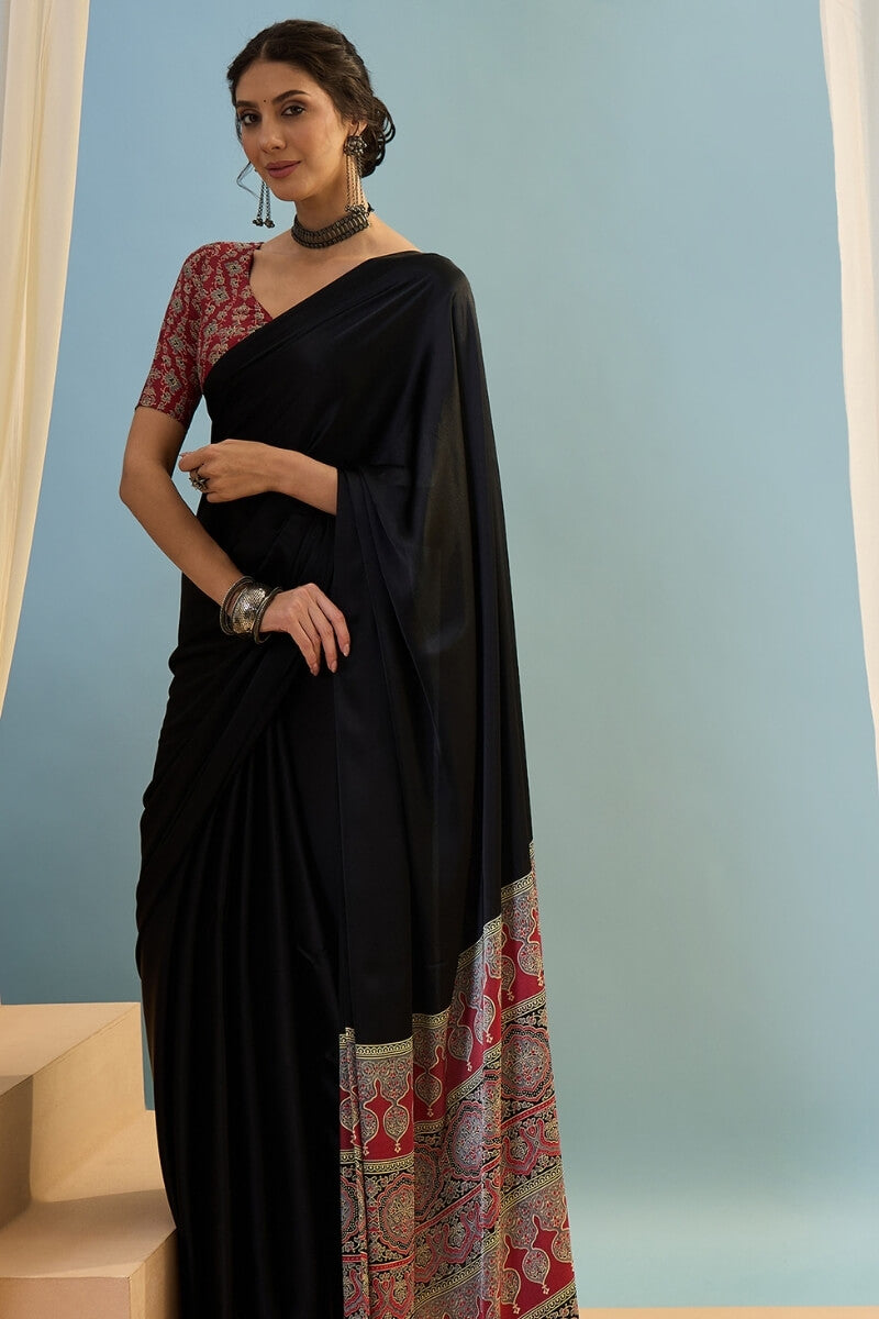 Innovative Black Ajrakh Printed Semi Modal Silk Saree With Snazzy Blouse Piece