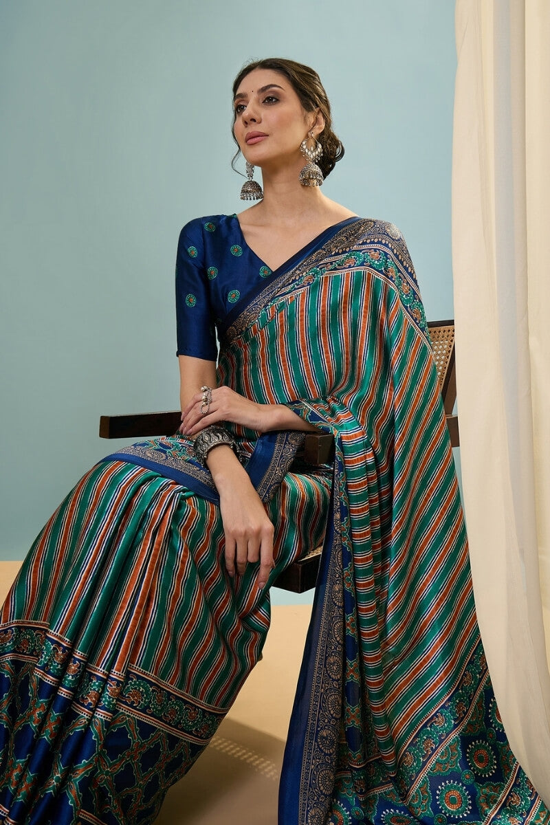 Sonorous Dark Green Ajrakh Printed Semi Modal Silk Saree With Breathtaking Blouse Piece