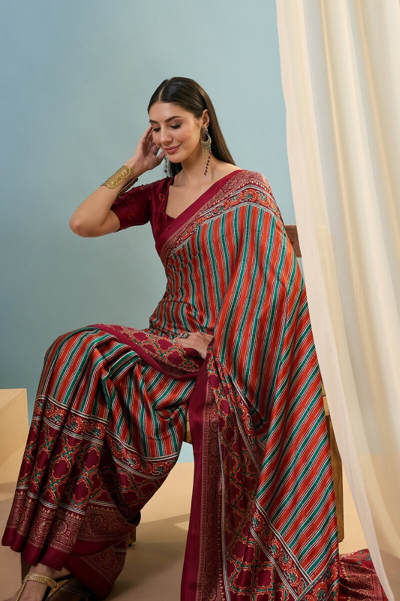 Enigmatic Red Ajrakh Printed Semi Modal Silk Saree With Blissful Blouse Piece