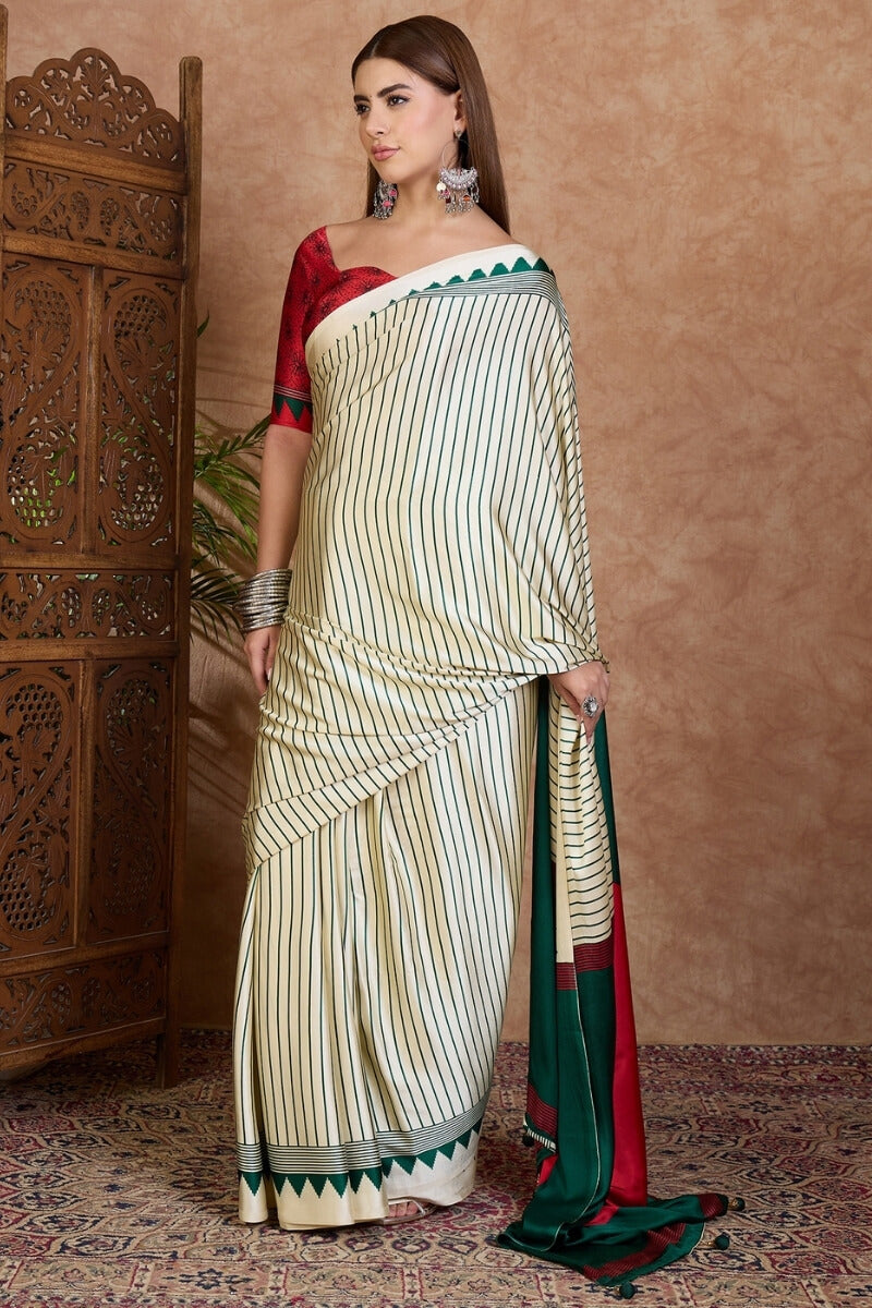 Glittering Off White Ajrakh Printed Semi Modal Silk Saree With Quixotic Blouse Piece